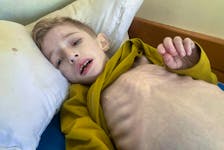 Malnourished Palestinian boy Fadi al-Zant lies on a bed at Kamal Adwan hospital, amid the ongoing conflict between Israel and Hamas, in northern Gaza, March 10, 2024. REUTERS/Osama Abu Rabee