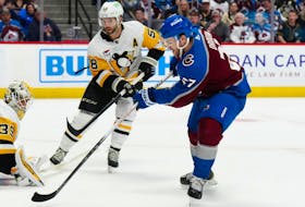 Colorado Avalanche winger Jonathan Drouin fires the overtime winner on Pittsburgh Penguins goaltender Alex Nedeljkovic after eluding defenceman Kris Letang during an NHL game Sunday afternoon at Ball Arena in Denver. - Ron Chenoy / USA Today Sports