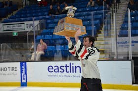 Kensington Moase Plumbing and Heating Vipers forward and assistant captain Brett Ballum, 20, hoists the P.E.I. junior B hockey championship trophy. Ballum, in his final year of eligibility, recorded two assists in the Vipers’ 5-2 win over the Sherwood-Parkdale A&SScrap Metal Metros at Eastlink Centre in Charlottetown on March 24. The win gave the Vipers a four-game sweep in the best-of-seven P.E.I. championship series. Jason Simmonds • The Guardian