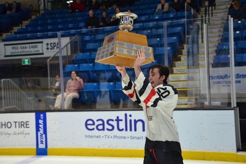 Kensington Moase Plumbing and Heating Vipers forward and assistant captain Brett Ballum, 20, hoists the P.E.I. junior B hockey championship trophy. Ballum, in his final year of eligibility, recorded two assists in the Vipers’ 5-2 win over the Sherwood-Parkdale A&SScrap Metal Metros at Eastlink Centre in Charlottetown on March 24. The win gave the Vipers a four-game sweep in the best-of-seven P.E.I. championship series. Jason Simmonds • The Guardian
