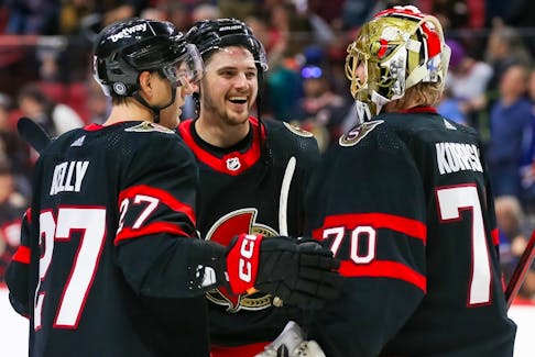 Parker Kelly and Drake Batherson of the Ottawa Senators celebrate with goalie Joonas Korpisalo after defeating the Edmonton Oilers at the Canadian Tire Centre on Sunday. Korpisalo will be in goal again on Thursday in Buffalo after back-to-back weekend wins.
