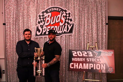 The Mallard Electric Hobby Stock Division champion was Cory Aker. From left, Aker and division sponsor Mike MacDougall. CONTRIBUTED/BUD’S SPEEDWAY