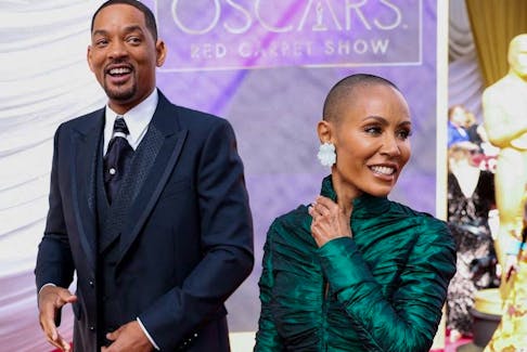 Will Smith and Jada Pinkett Smith pose on the red carpet during the Oscars arrivals at the 94th Academy Awards in Hollywood, Calif., March 27, 2022.