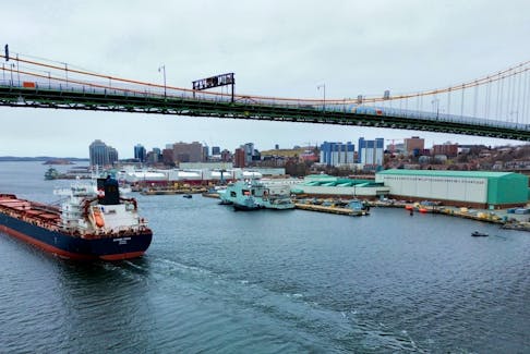 FOR SPURR STORY: 
The self discharging bulk carrier, Algoma Vision, passes beneath the Macdonald Bridge as it leaves the port of Halifax Tuesday March 26, 2024.

TIM KROCHAK PHOTO