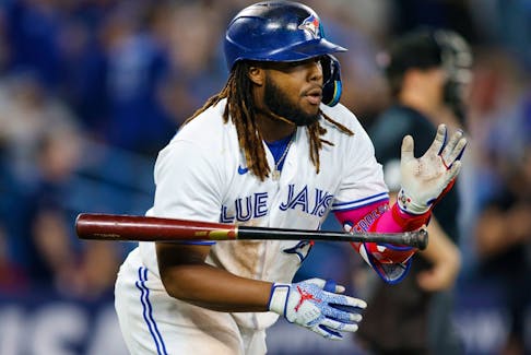 Vladimir Guerrero Jr. of the Blue Jays flips his bat after hitting a solo home run against the Cleveland Guardians in 2023.
