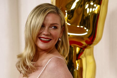 Kirsten Dunst poses on the red carpet during the Oscars arrivals at the 96th Academy Awards in Hollywood, Los Angeles, California, U.S., March 10, 2024.