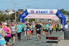 Runners and walkers leave the start line in Paradise during the 95th Tely 10 on June 25, 2023.  — Joe Gibbons/The Telegram