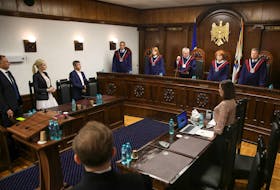 Head of Moldova's Constitutional Court Nicolae Rosca reads out the ruling during a hearing to verify the constitutionality of the opposition pro-Russian political party Shor in Chisinau, Moldova, June 19, 2023.