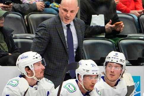 Vancouver Canucks head coach Rick Tocchet. Nikita Zadorov said Tocchet's approach, where he speaks mostly supportively but occasionally critically, is necessary.
