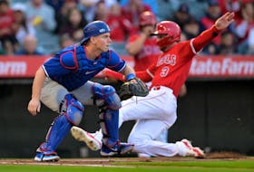 Mar 26, 2024; Anaheim, California, USA;  Los Angeles Angels shortstop Zach Neto (9) beats the throw to Los Angeles Dodgers catcher Will Smith (16) to score a run in the first inning at Angel Stadium. Mandatory Credit: Jayne Kamin-Oncea-USA TODAY Sports/File Photo