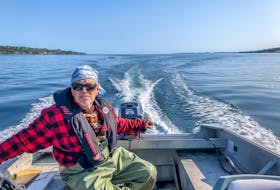 Nothing will keep you dry like rubber commercial fishing pants. Paul Smith is also wearing a much-loved sweater his mother knit him 45 years ago. - Paul Smith