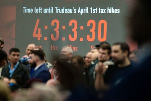 A countdown clock to the April 1, 2024 carbon tax increase is visible behind the crowd as Pierre Poilievre holds a 'Spike the Hike - Axe the Tax' rally, in Edmonton Wednesday March 27, 2024. 