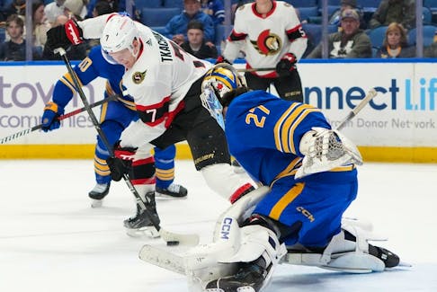 Brady Tkachuk of the Ottawa Senators scores a goal against Devon Levi of the Buffalo Sabres during the first period at KeyBank Center on March 27, 2024 in Buffalo.