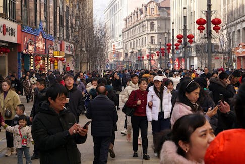 Visitors throng a pedestrian shopping street on the first day of the Lunar New Year of the Dragon, in Shanghai, China February 10, 2024.