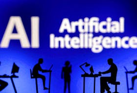 Figurines with computers and smartphones are seen in front of the words "Artificial Intelligence AI" in this illustration taken, February 19, 2024.