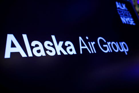 A screen displays the logo of Alaska Air Group on the floor at the New York Stock Exchange (NYSE) in New York City, U.S., December 4, 2023. 