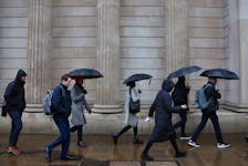Commuters walk during the morning rush hour near the Bank of England in the City of London financial district in London, Britain, February 8, 2024.