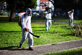 Health worker Javier Bellanzoni sprays insecticide to kill mosquitoes at a public park as dengue cases spike during a major outbreak, in Buenos Aires, Argentina March 26, 2024.