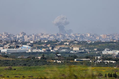 Smoke rises over Gaza following an explosion, amid the ongoing conflict between Israel and the Palestinian Islamist group Hamas, as seen from Israel, March 27, 2024.