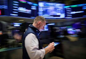 A trader works on the floor at the New York Stock Exchange (NYSE) in New York City, U.S., March 7, 2024. 