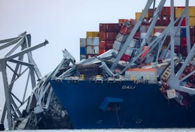 Wreckage lies across the deck of the Dali cargo vessel, which crashed into the Francis Scott Key Bridge causing it to collapse, in Baltimore, Maryland, U.S., March 27, 2024.