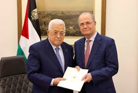 Palestinian President Mahmoud Abbas appoints Mohammad Mustafa as prime minister of the Palestinian Authority (PA), in Ramallah, in the Israeli-occupied West Bank March 14, 2024 in this handout image. Palestinian president office/Handout via