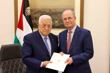 Palestinian President Mahmoud Abbas appoints Mohammad Mustafa as prime minister of the Palestinian Authority (PA), in Ramallah, in the Israeli-occupied West Bank March 14, 2024 in this handout image. Palestinian president office/Handout via