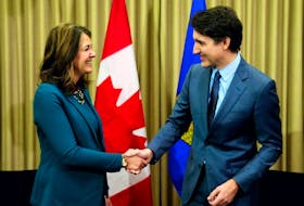 Prime Minister Justin Trudeau meets with federal carbon tax critic Alberta Premier Danielle Smith in Calgary on Wednesday, March 13, 2024.