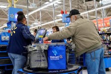 A customer bags his groceries after shopping at a Walmart store ahead of the Thanksgiving holiday in Chicago, Illinois, U.S. November 27, 2019.
