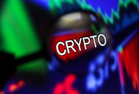 Word "Crypto" and stock graph are seen through magnifier displayed in this illustration taken September 4, 2022.