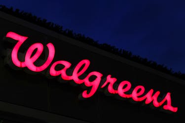 Signage is seen outside of a Walgreens, owned by the Walgreens Boots Alliance, Inc., in Manhattan, New York City, U.S., November 26, 2021.