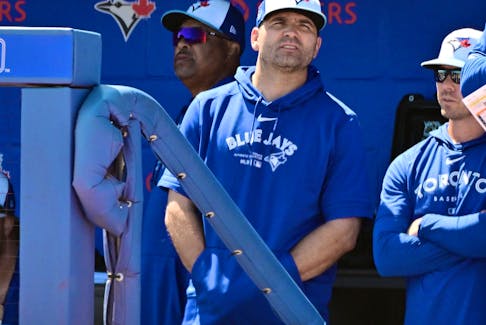 Joey Votto of the Toronto Blue Jays looks on from the dugout during spring training.