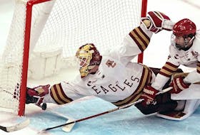  Boston College goaltender Jacob Fowler (1) makes a save on Boston University during the third period of the Hockey East championship game March 23 in Boston.