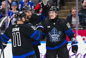 Toronto Maple Leafs left wing Tyler Bertuzzi (59) celebrates his goal against the Washington Capitals with forward Max Domi (11) and defenceman TJ Brodie (78) during second period at Scotiabank Arean on Thursday night. 
