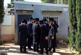 Ultra-Orthodox Jews line up at an Israeli draft office to process their exemptions from mandatory military service at a recruitment base in Kiryat Ono, Israel March 28, 2024.
