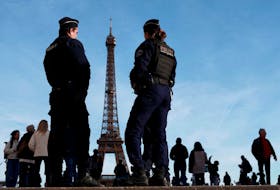 French police patrol at the Trocadero square near the Eiffel Tower in Paris, France, March 4, 2024.
