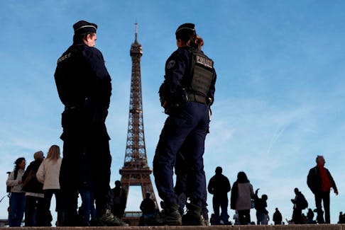 French police patrol at the Trocadero square near the Eiffel Tower in Paris, France, March 4, 2024.