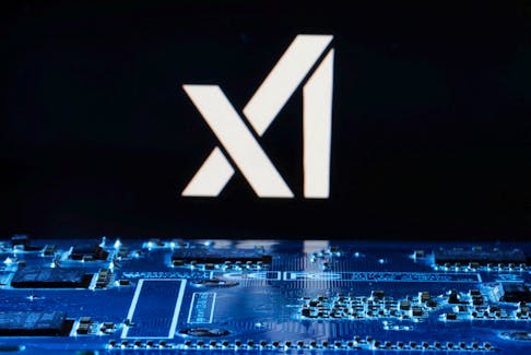 xAI logo is seen near computer motherboard in this illustration taken January 8, 2024.