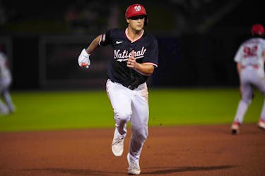 Mar 8, 2024; West Palm Beach, Florida, USA; Washington Nationals third baseman Nick Senzel (13) advances to third base on a base hit in the fourth inning against the St. Louis Cardinals at CACTI Park of the Palm Beaches. Mandatory Credit: Jim Rassol-USA TODAY Sports/File Photo