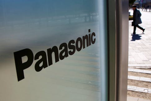 A man is seen next to Panasonic Corp's logo at Panasonic Center in Tokyo, Japan, February 2, 2017. 