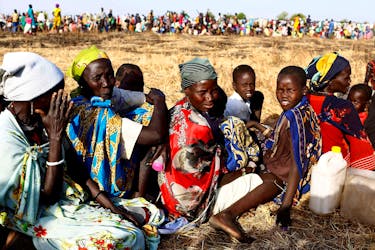 Women and children wait to be registered prior to a food distribution carried out by the United Nations World Food Programme (WFP) in Thonyor, Leer state, South Sudan, February 25, 2017.