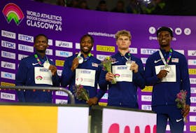 Athletics - World Athletics Indoor Championships - Commonwealth Arena, Glasgow, Scotland, Britain - March 3, 2024 Silver medallist Noah Lyles, Jacory Patterson, Matthew Boling and Christopher Bailey of the U.S. celebrate on the podium after the men's 4x400m relay