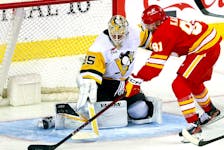 Calgary Flames Nazem Kadri scores a beauty goal against Pittsburgh Penguins goalie Tristan Jarry in third-period NHL action at the Scotiabank Saddledome in Calgary on Saturday, March 2, 2024.