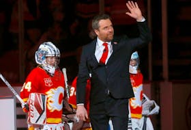 Miikka Kiprusoff waves as the Calgary Flames retire his No. 34 at the Scotiabank Saddledome on Saturday, March 2, 2024.