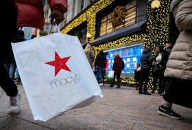 A customer exits the Macy's flagship department store in midtown Manhattan in New York City, U.S., December 11, 2023. 