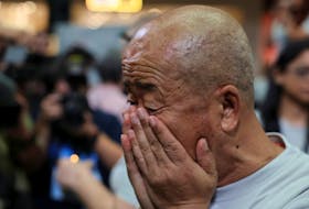 A family member of the missing Malaysia Airlines flight MH370 reacts during a remembrance event marking the 10th anniversary of its disappearance, in Subang Jaya, Malaysia March 3, 2024.