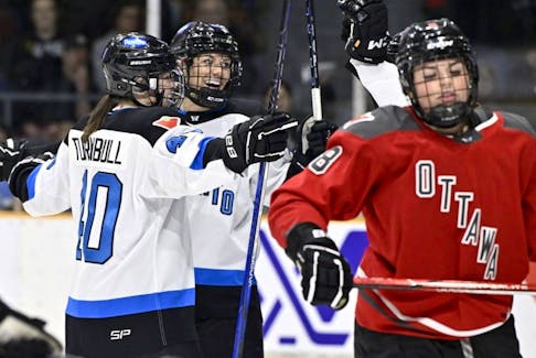 Toronto's Natalie Spooner (24) celebrates her goal with Blayre Turnbull (40) as Ottawa's Natalie Snodgrass (8) skates away, during first period PWHL action in Ottawa, Saturday, March 2, 2024. 