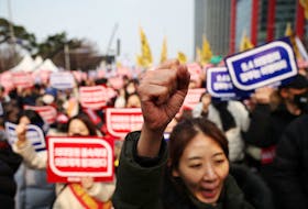 Doctors chant slogans during a rally to protest against government plans to increase medical school admissions in Seoul, South Korea, March 3, 2024.  