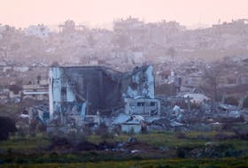 A damaged building from Gaza is pictured, amid the ongoing conflict between Israel and Palestinian Islamist group Hamas, as seen from Southern Israel, March 2, 2024.