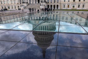 The U.S. Capitol dome is seen in a reflection outside the United States Capitol building in Washington, U.S., September 22, 2023.